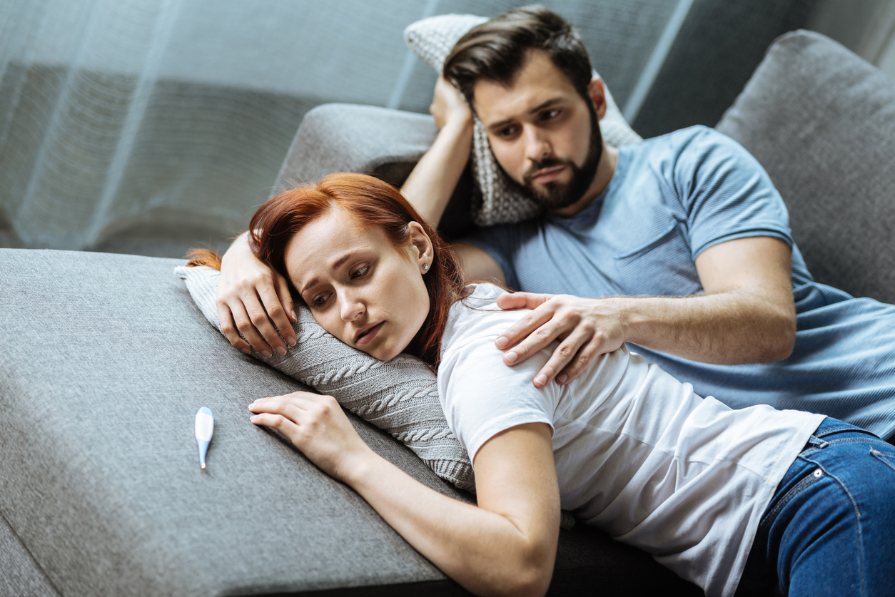 Sad cheerless man caring about his girlfriend